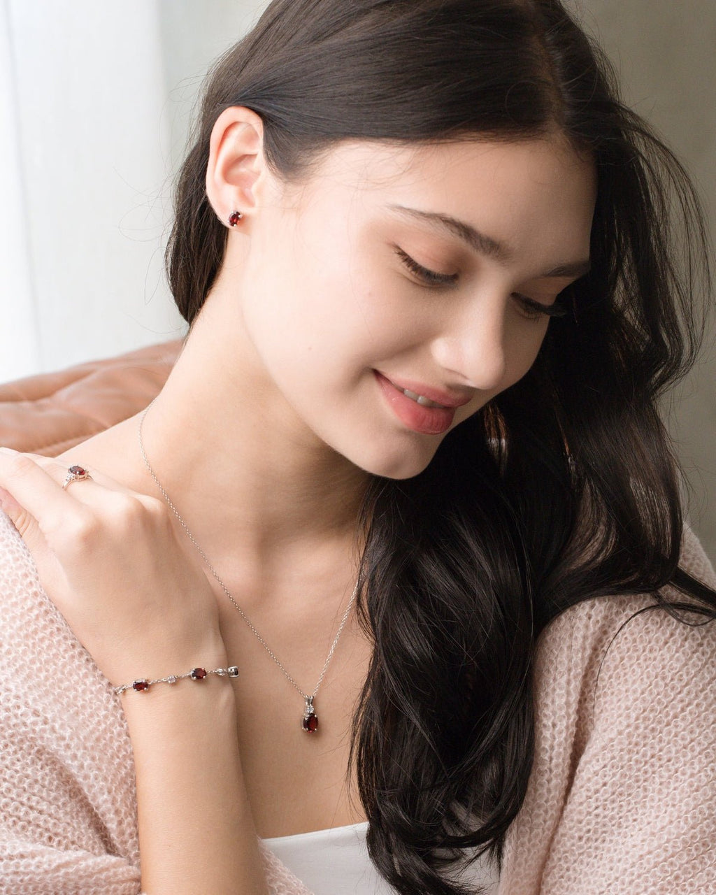 Garnet Oval Stud Earrings in Sterling Silver