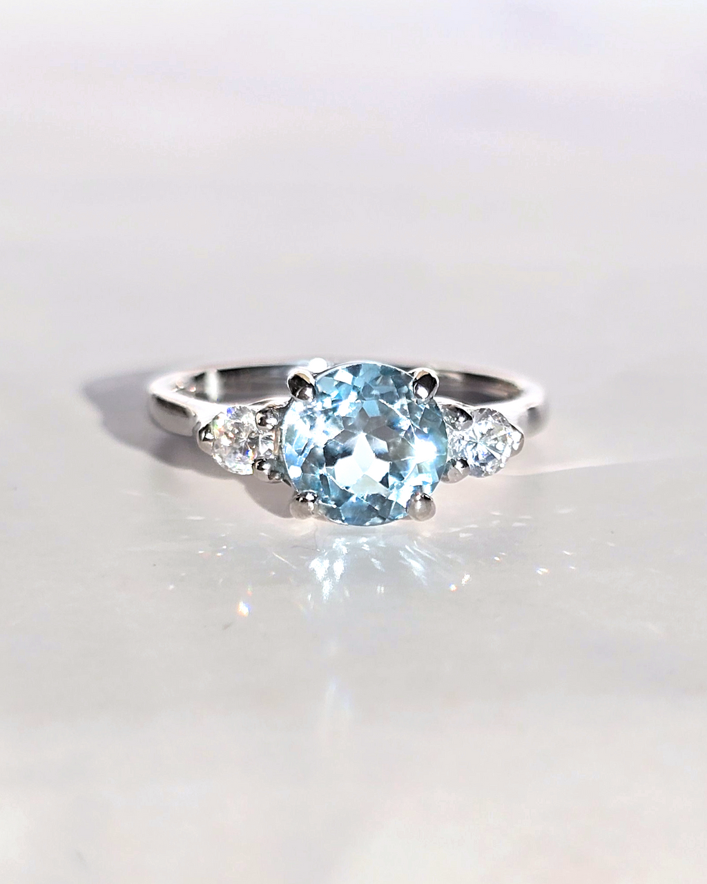Blue Topaz Three Stone Ring in Sterling Silver