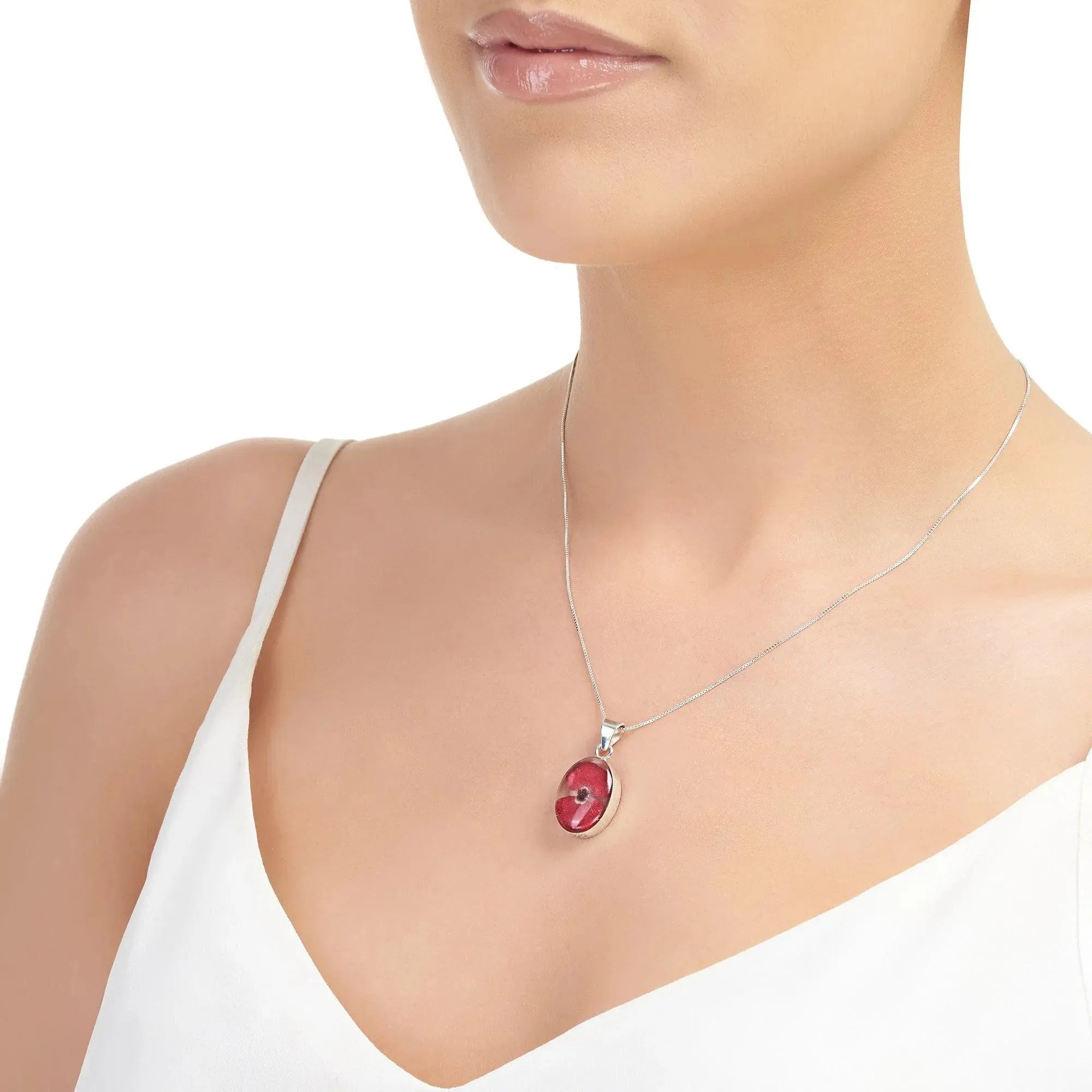 Poppy necklace by Shrieking Violet® Sterling silver oval pendant handmade with a single mini Euphorbia milii